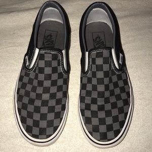Black and grey checkered slip on vans